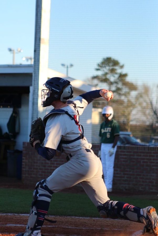 man throwing baseball