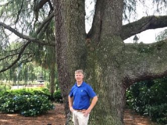 man in front of tree