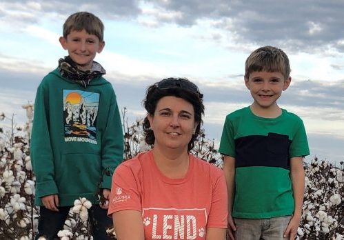 Mom with sons in cotton field