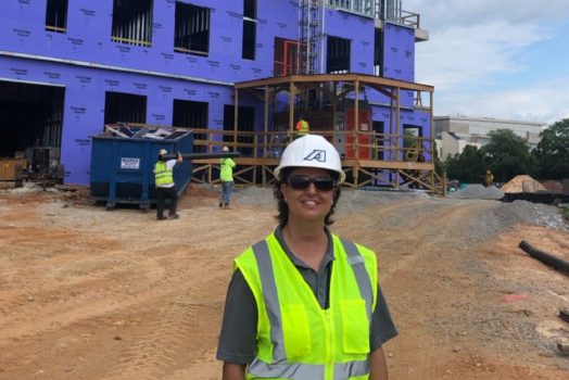 female in hardhat at construction site
