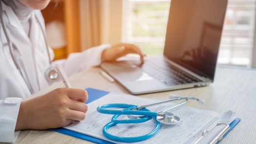 Student with computer, stethescope