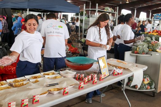 People standing in front of food