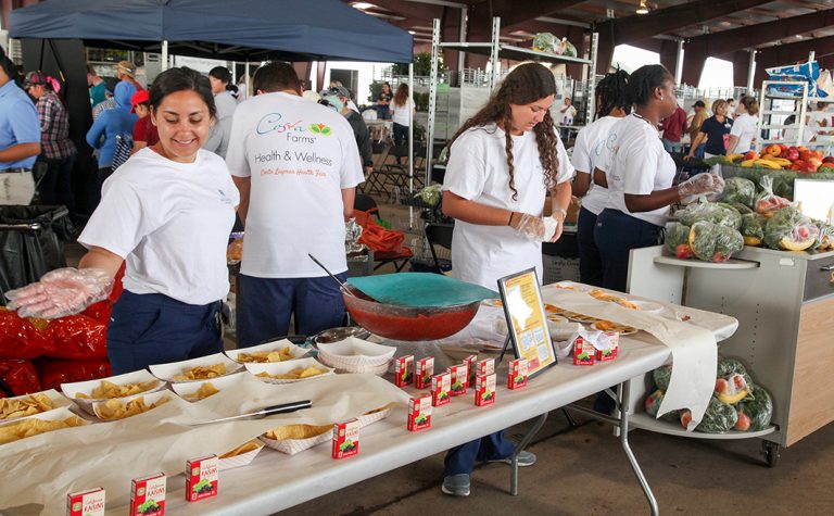 People standing in front of food