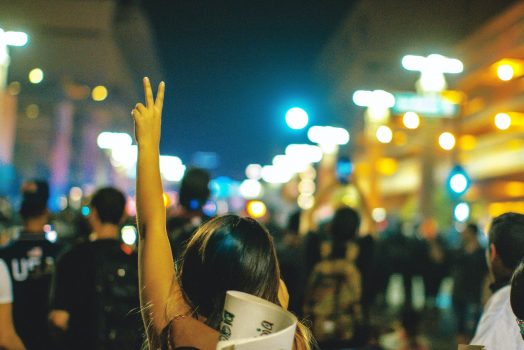 Woman raising the peace sign