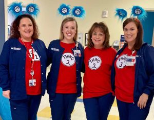 Four women dressed as Dr. Seuss characters