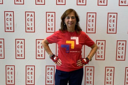 Dr. Martha Tingen standing in front of a sign
