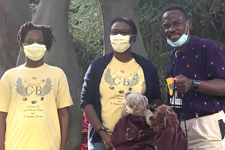 3 people with gift bags