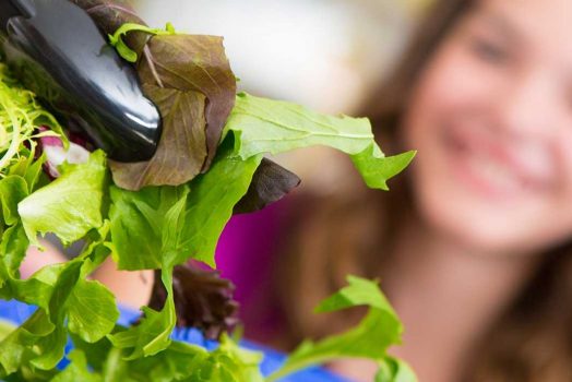 Lettuce picked up by tongs
