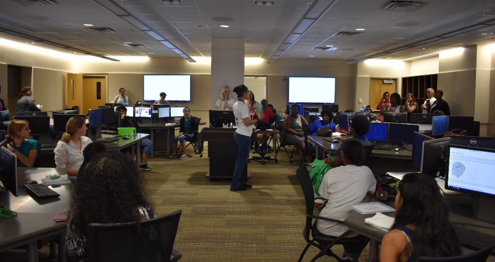 Julianna Rodriguez leading a Girls Who Code meeting. 