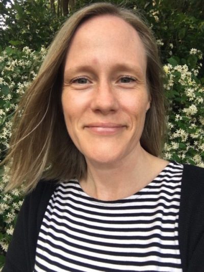 Woman in black and white striped shirt