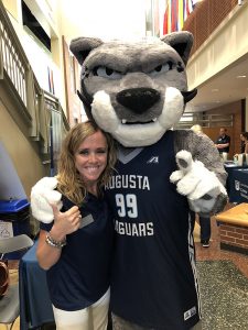 Woman and jaguar mascot