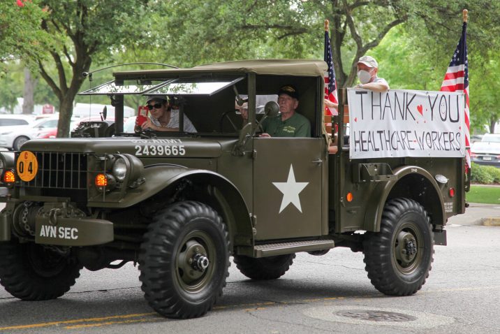 military truck with thank you healthcare workers sign