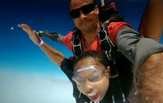man and woman skydiving