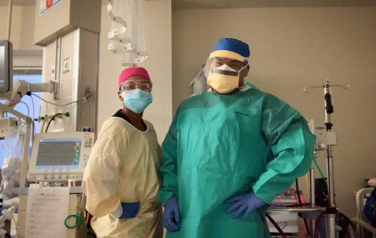 Two respiratory therapists in PPE