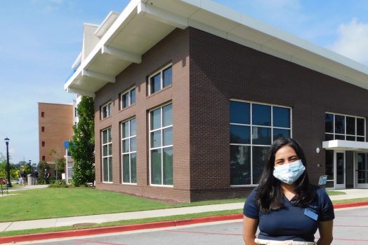 woman in front of building