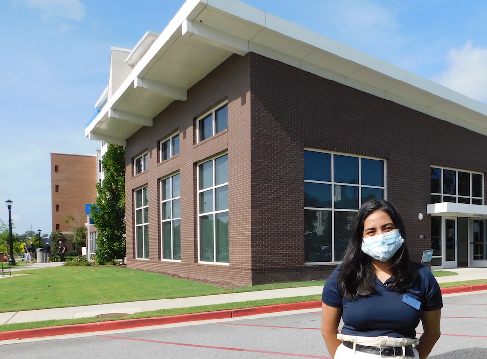 woman standing by residence hall