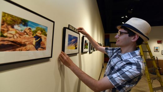 man hanging photograph