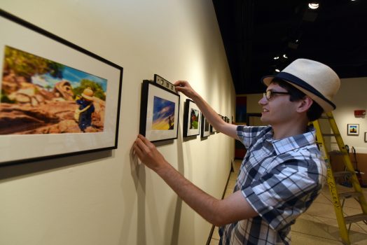 man hanging photograph