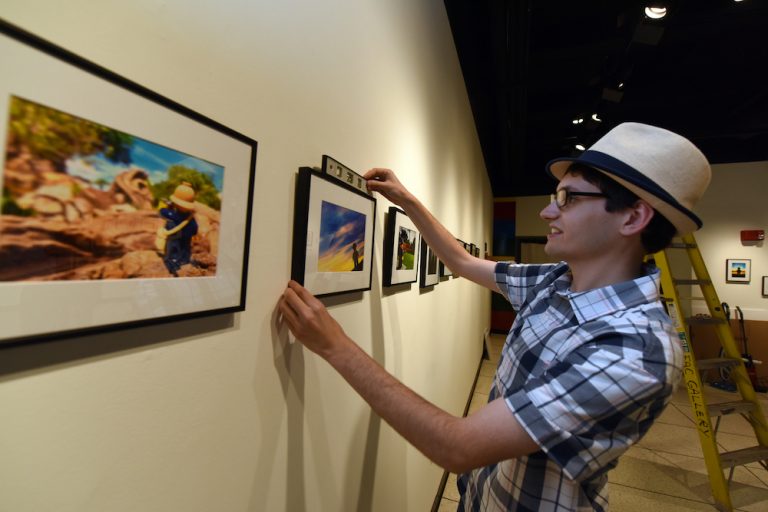 man hanging photograph