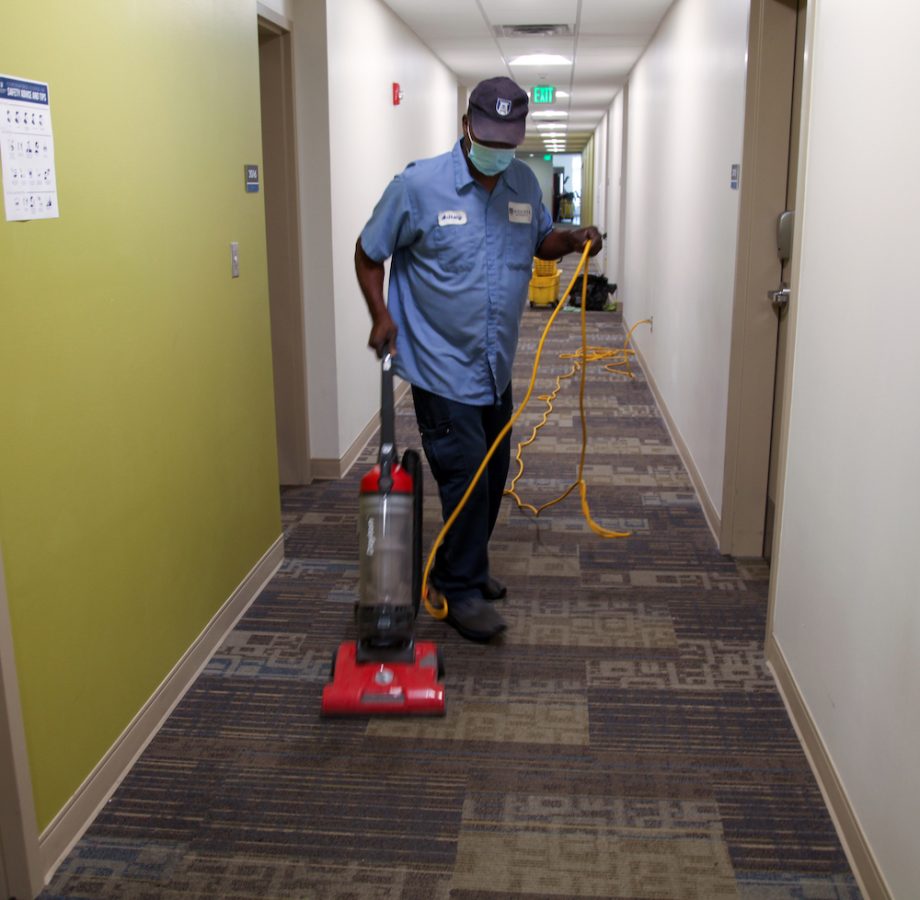 man vacuuming