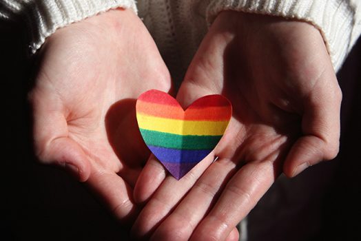 Hand with rainbow heart