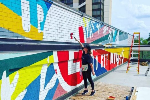 April Henry King paints mural