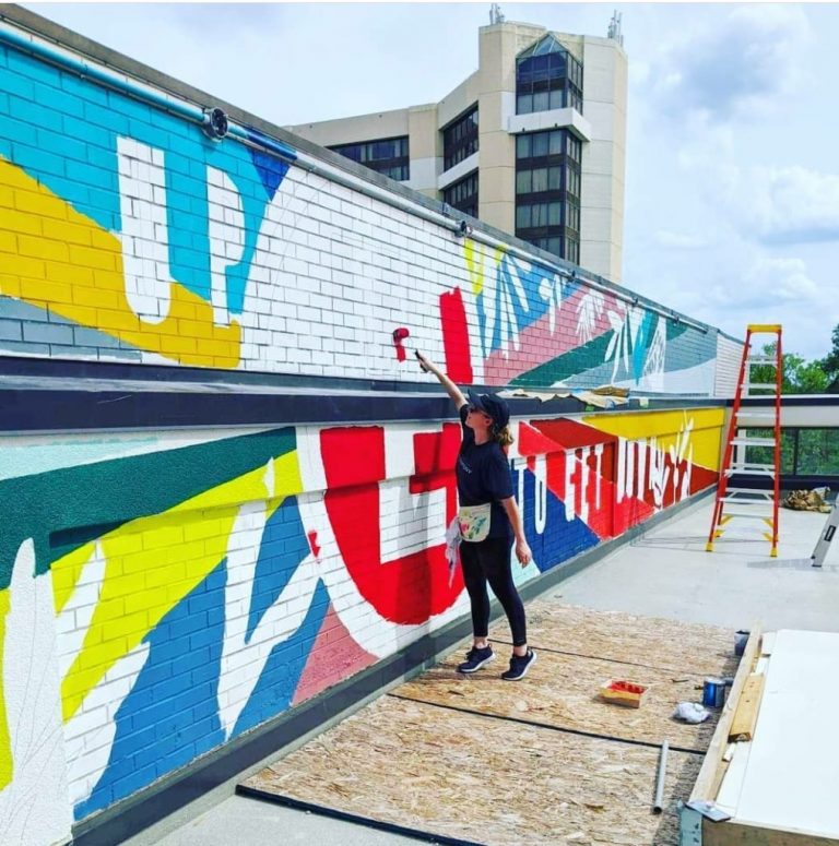 April Henry King paints mural