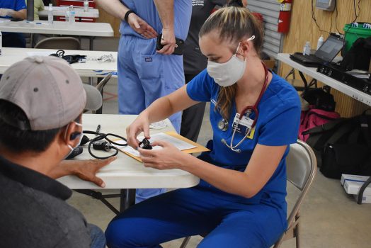 Woman helping patient