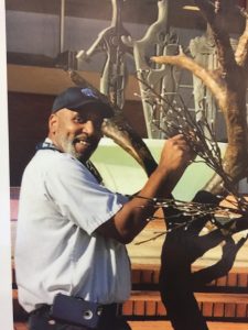 Man working with lights on tree