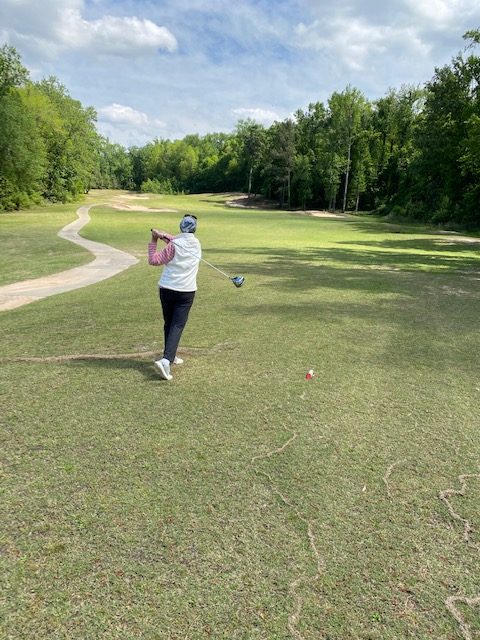 woman playing golf