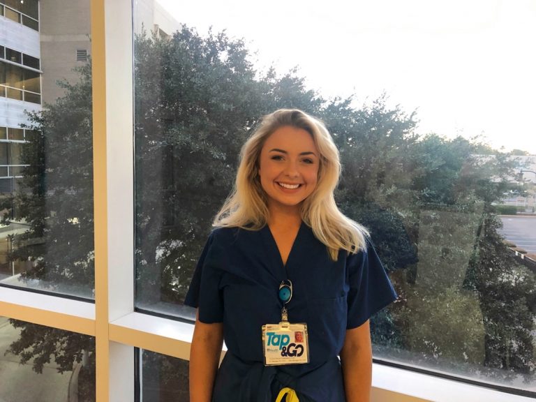nurse in front of window