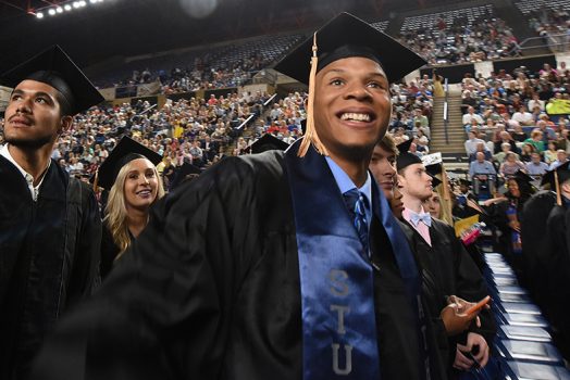 man in cap and gown