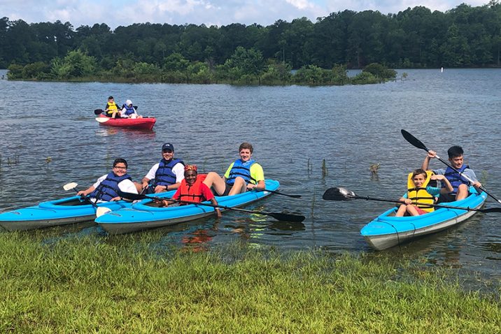 people in kayaks