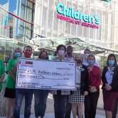 People holding check