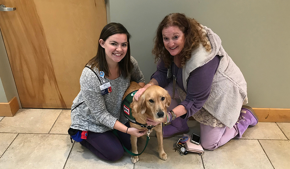 photo of women with a dog