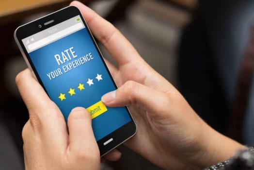 hands holding phone clicking ratings