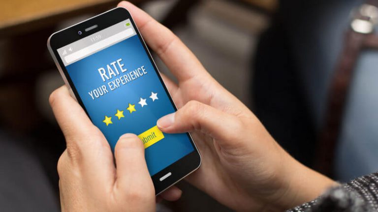 hands holding phone clicking ratings