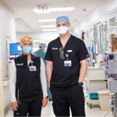 people standing in a hallway