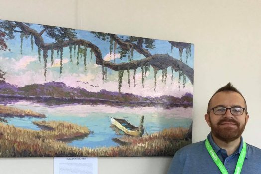 Artist with painting