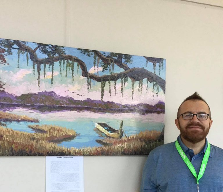 Artist with painting