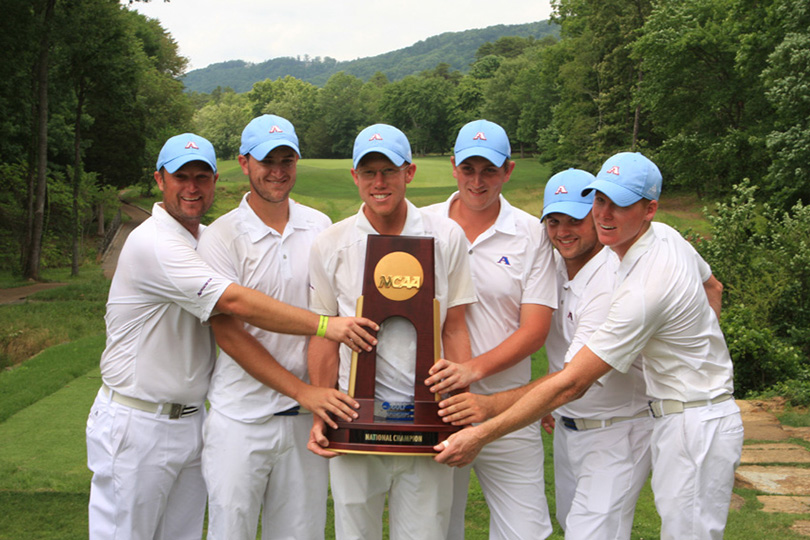 Golfers with trophy