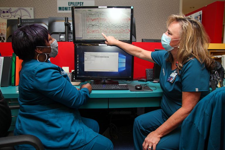 Two women look at computer