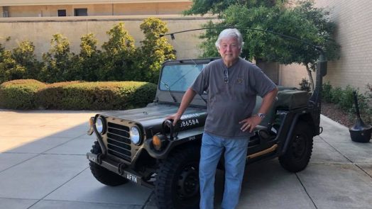 man in front of jeep