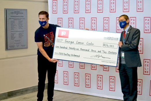 Two men with check