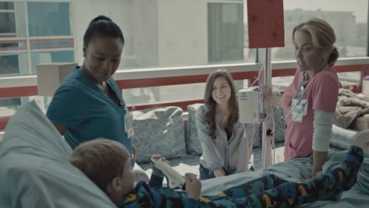 doctor, nurse, mom and kid in hospital room