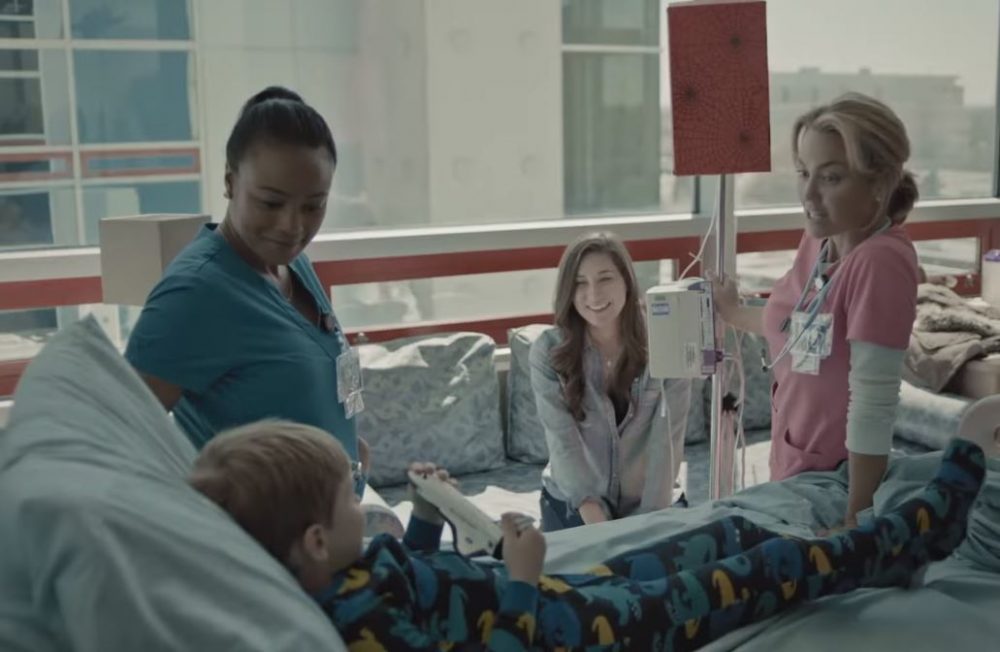 doctor, nurse, mom and kid in hospital room