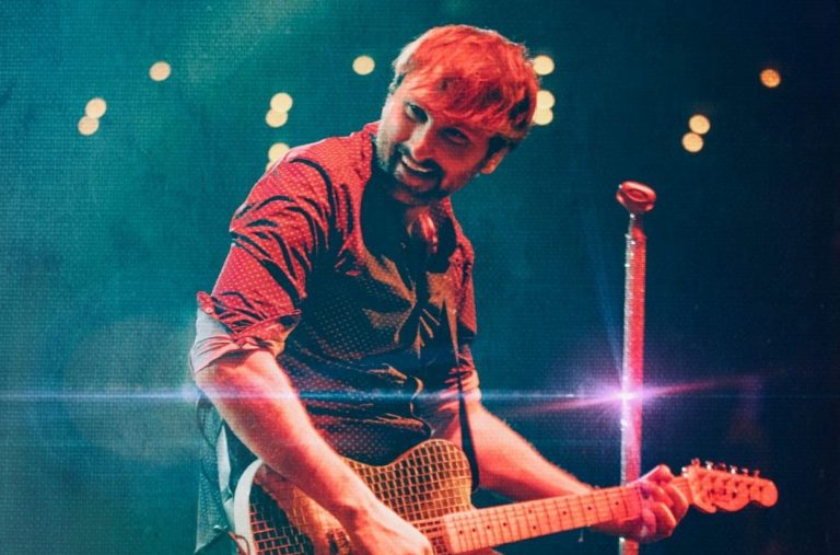 Man playing a guitar