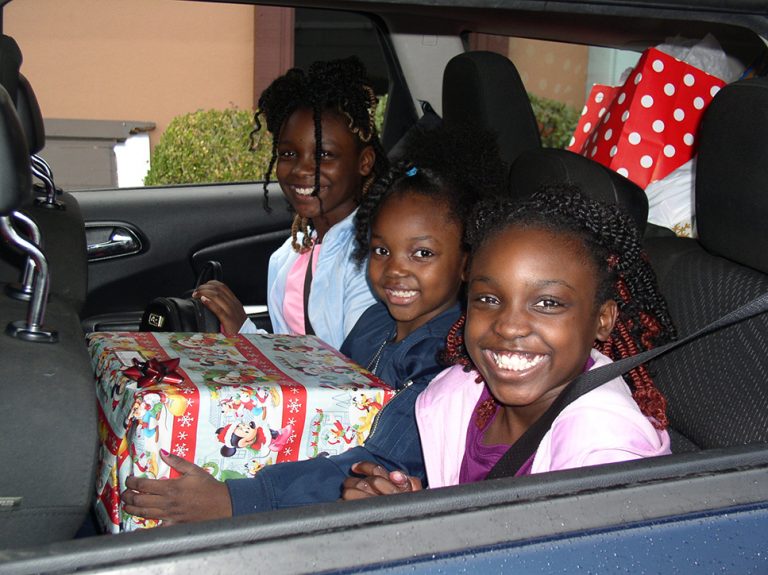 Three girls smiling