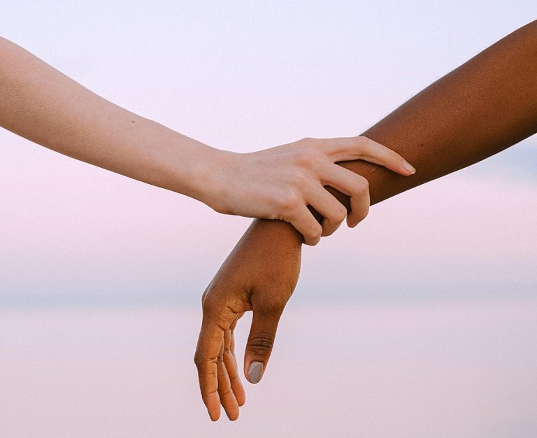 Hand holding arm