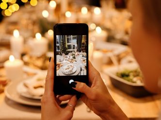 cellphone taking photo of holiday table